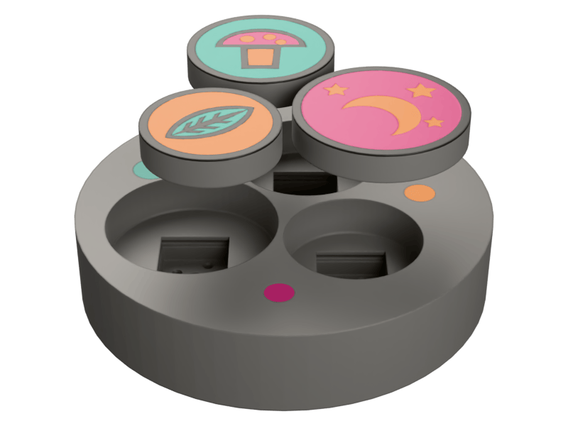 A printed fidget clicker in pieces: three round caps, each carrying different artwork — a mushroom on mint, a leaf on peach, a crescent moon and stars on pink — floating above the gray base that sockets a switch under each of them